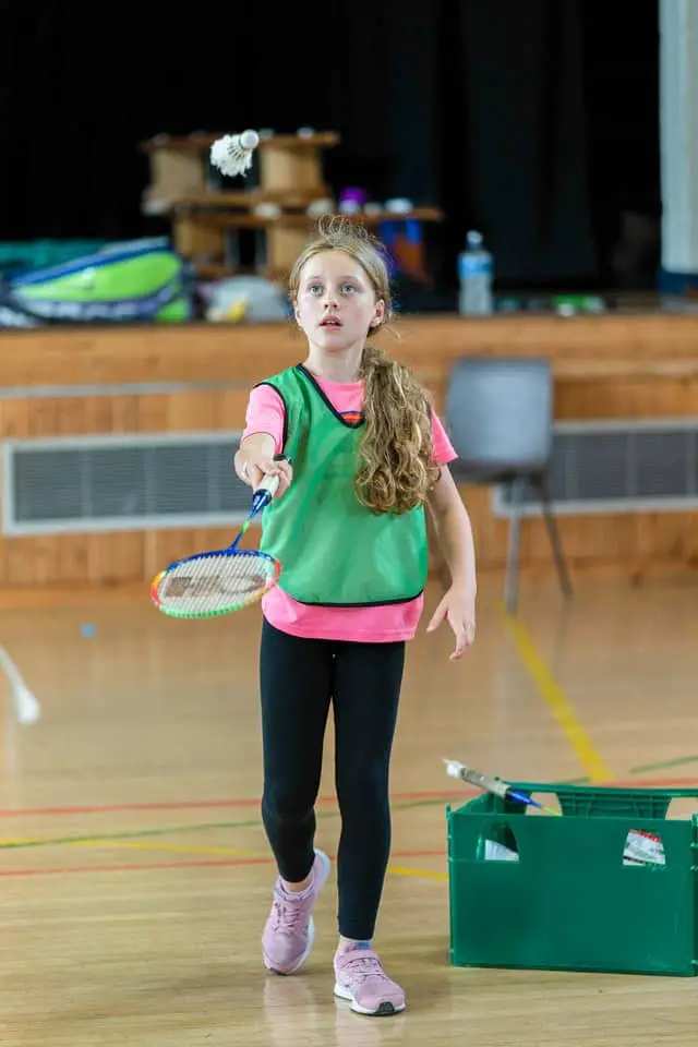 girl playing badminton